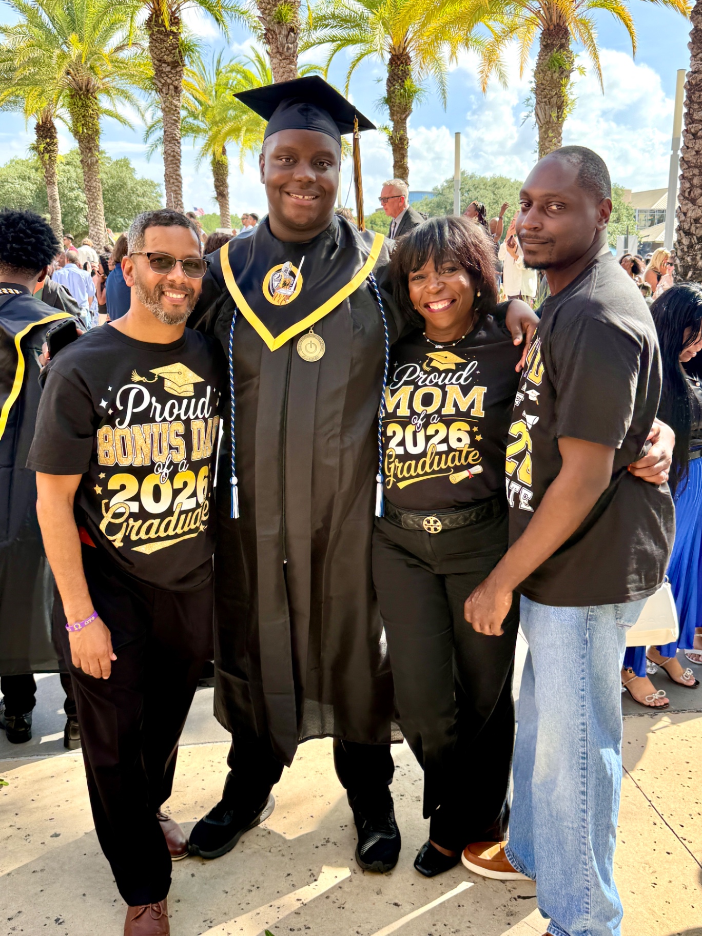Roberta with her husband Neil and their two sons celebrating a 2026 graduation.